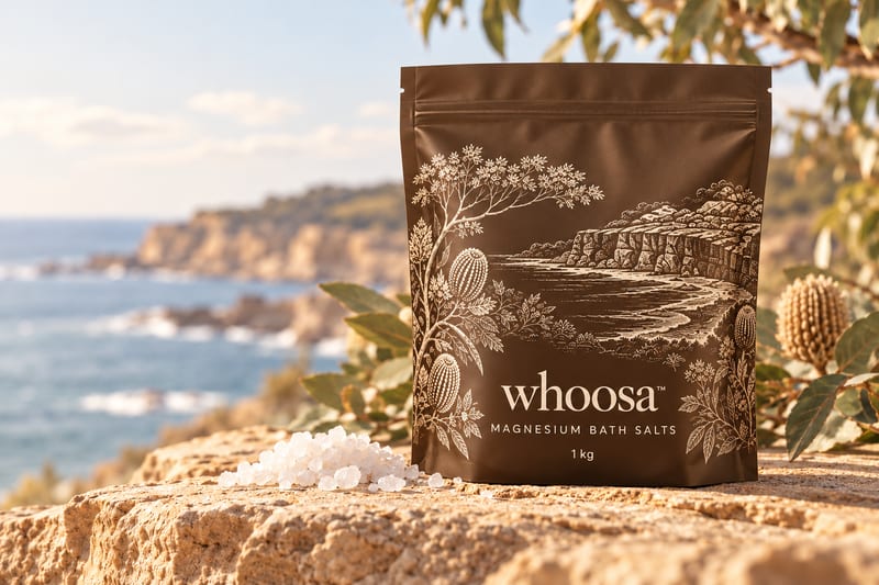 Concept render of the WHOOSA Bath Soak pouch with ivory coastal linework on sandstone, shown for the The Long Night Christmas Box 2026